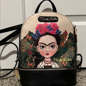 Artistic Black and Cream Backpack with Vibrant Design